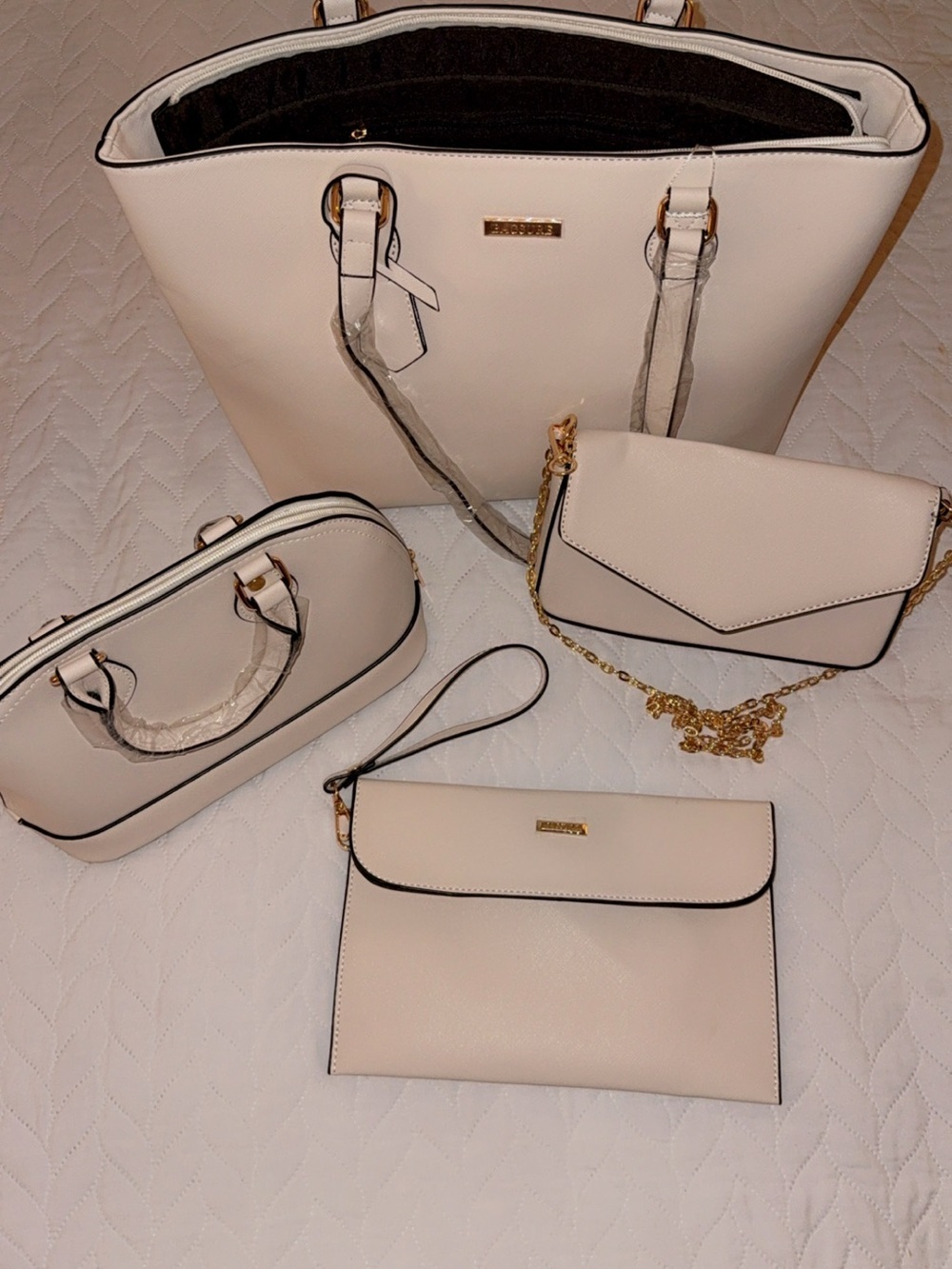 Set of four Cream Tote Purses with Black Trim and Gold Hardware